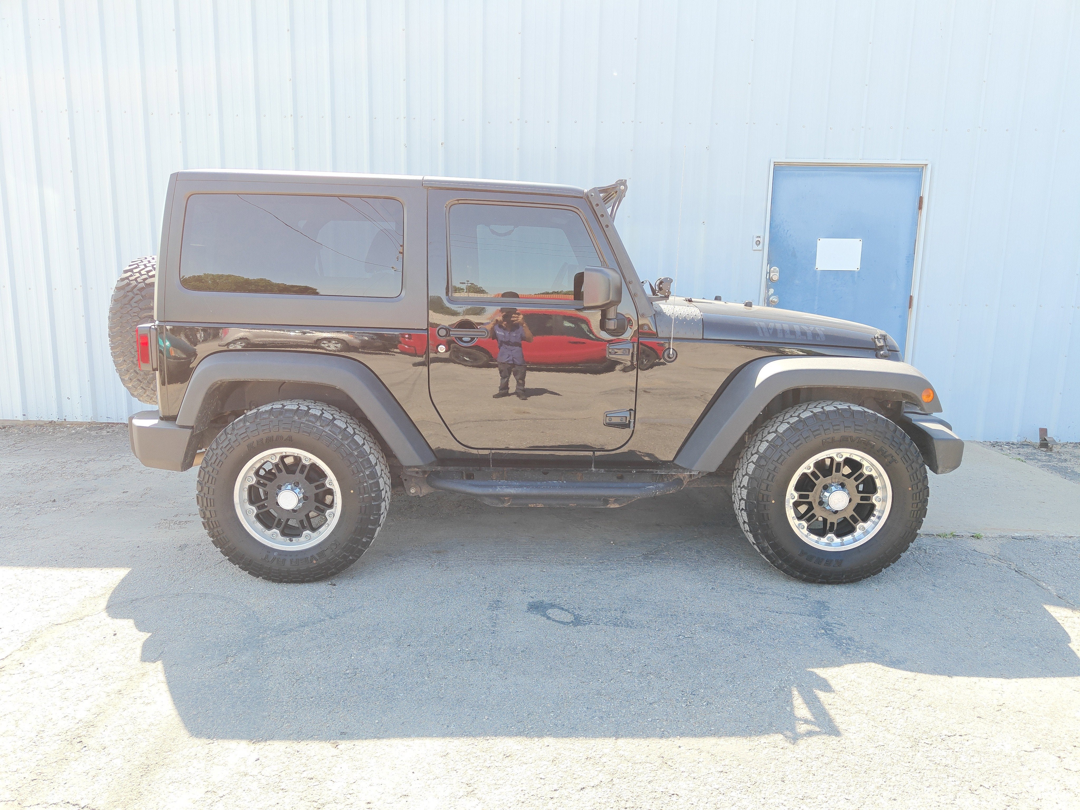 2017 Jeep Wrangler Willys Wheeler in Black Clearcoat — front three-quarter view
