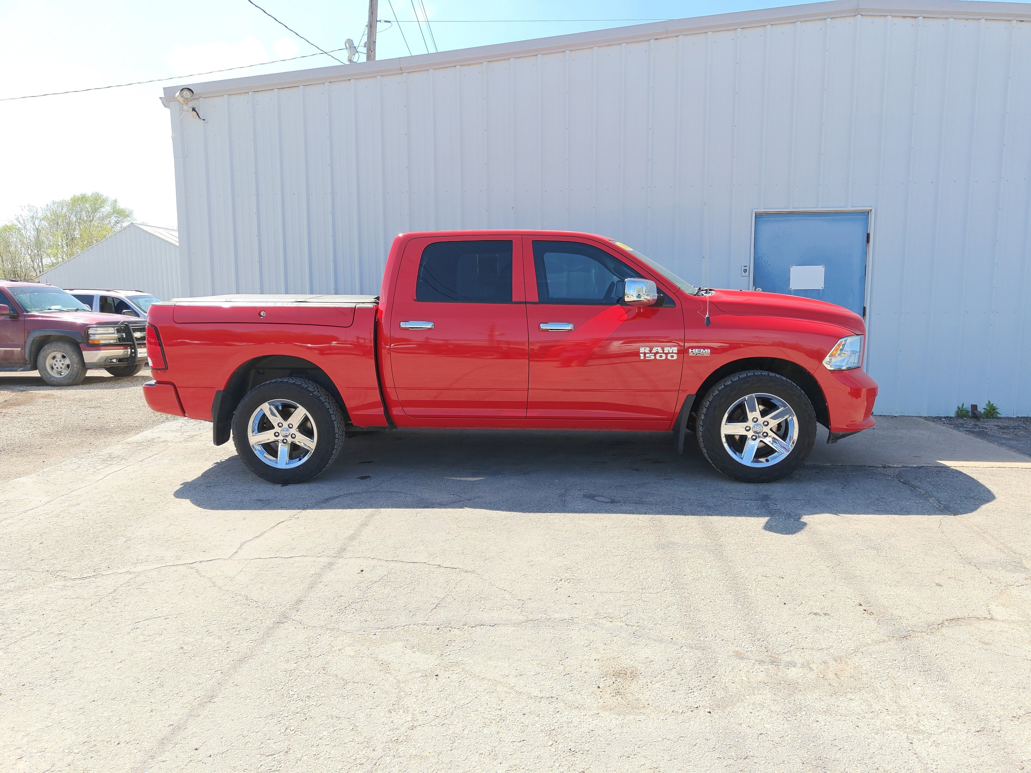 2014 RAM 1500 Express in Flame Red Clearcoat — front three-quarter view