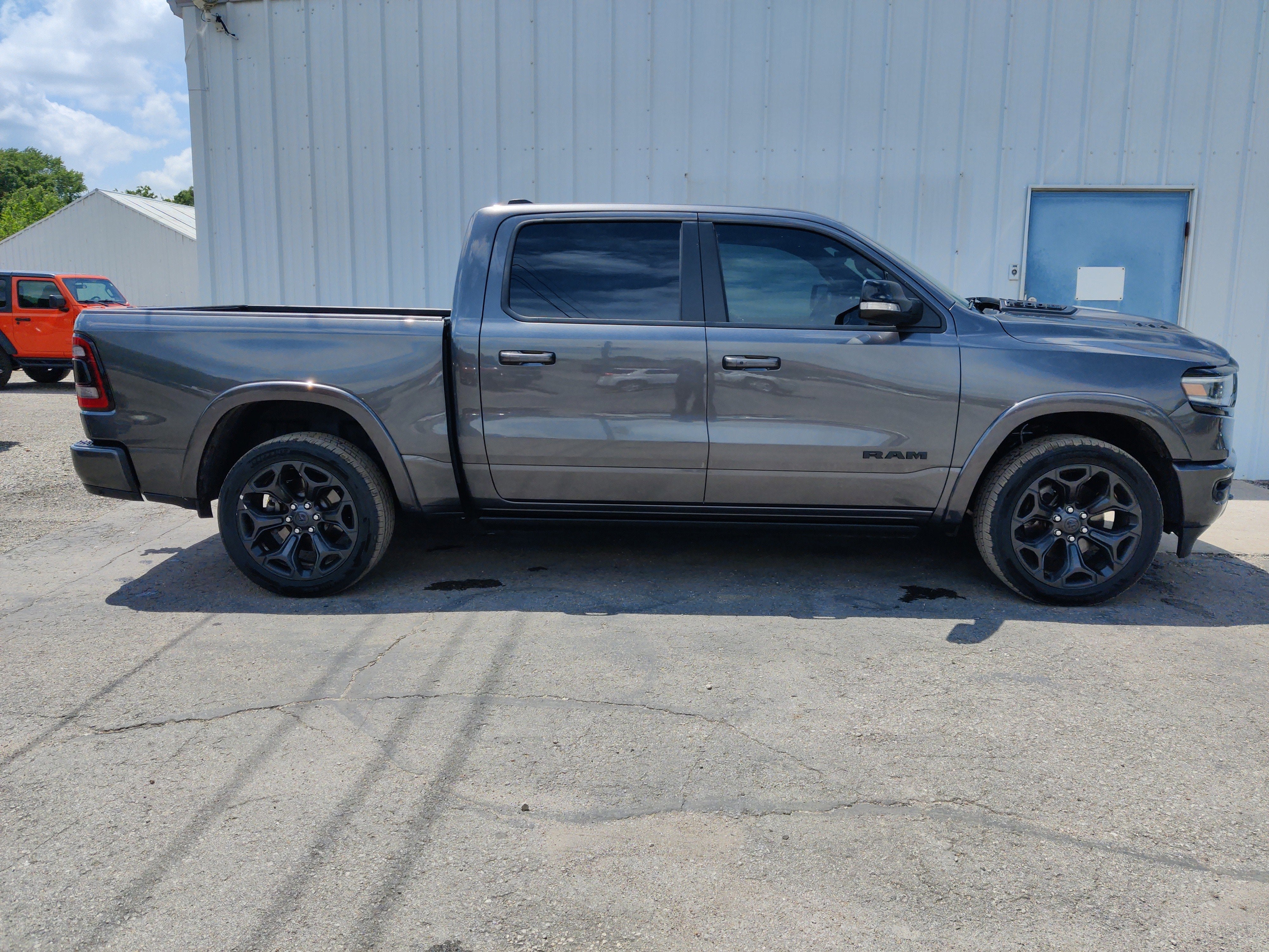 2021 RAM 1500 Limited Crew Cab 4x4 5'7' Box in Granite Crystal Metallic Clearcoat — front three-quarter view